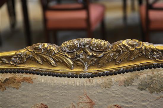 A Louis XV style floral carved three piece suite,